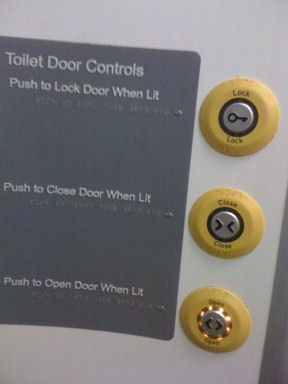 Braille signs saying 'Push when lit'